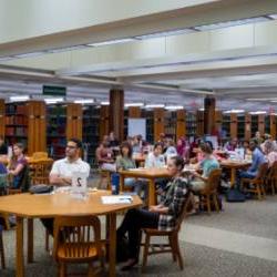 Students gathered around tables in Moon Library